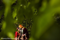 Maharani and Indian groom sharing a moment while hidden Maharani and Indian groom sharing a moment while hidden