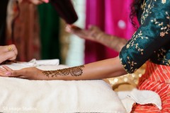 Closeup capture of maharani getting her henna art done. Closeup capture of maharani getting her henna art done.