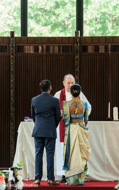 A priest officiating the Indian christian wedding ceremony A priest officiating the Indian christian wedding ceremony