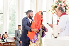 Indian groom covering his Maharani with a veil Indian groom covering his Maharani with a veil
