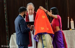 Indian groom and Indian bride exchanging rings Indian groom and Indian bride exchanging rings