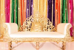 The golden and white couch on the stage The golden and white couch on the stage