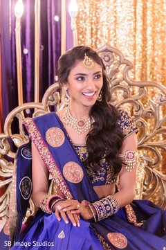 Maharani in a blue anarkali sitting on stage Maharani in a blue anarkali sitting on stage