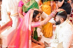 Maharani touching her gromm's head. Maharani touching her gromm's head.