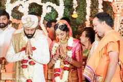 Maharani and Raja praying during their wedding ceremony. Maharani and Raja praying during their wedding ceremony.