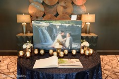 Table with a photo book of the Indian couple. Table with a photo book of the Indian couple.