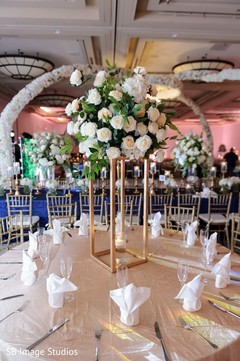 Center decorations made with roses and a candle. Center decorations made with roses and a candle.