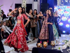 Maharani performing in reception wearing a red lengha. Maharani performing in reception wearing a red lengha.