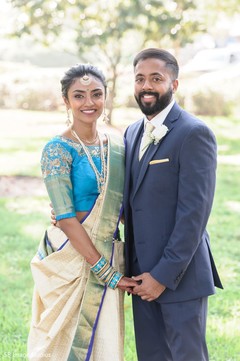 Indian couple posing on their Indian christian wedding outfits. Indian couple posing on their Indian christian wedding outfits.