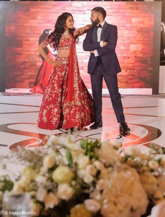 Indian couple posing on reception dance floor. Indian couple posing on reception dance floor.