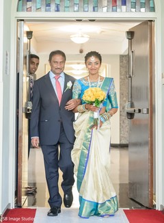 Indian bride walking down the aisle with her father. Indian bride walking down the aisle with her father.