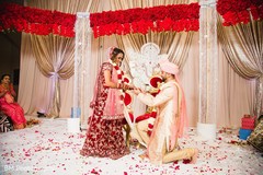 Indian groom kneeling before his Maharani Indian groom kneeling before his Maharani