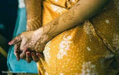 A close up to the Indian bride Henna stained hands A close up to the Indian bride Henna stained hands