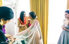 Indian bride getting ready with the help of her Indian relatives Indian bride getting ready with the help of her Indian relatives