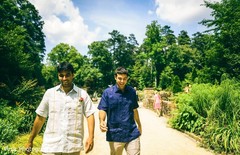 Indian groom and Indian relative walking down a road Indian groom and Indian relative walking down a road