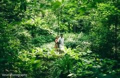 Indian bride hugging his Indian groom surrounded by nature Indian bride hugging his Indian groom surrounded by nature