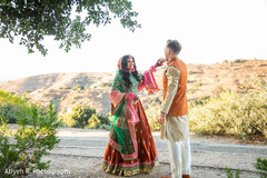 Indian couple holding hands during photo shoot. Indian couple holding hands during photo shoot.