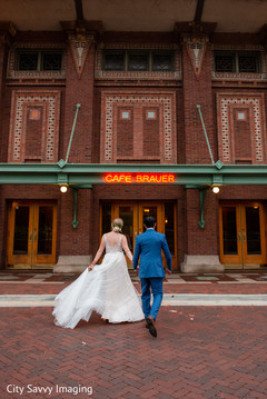 Indian bride and groom walking into their wedding location. Indian bride and groom walking into their wedding location.