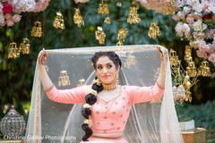 Indian bride's baby pink saree style and ghoonghat. Indian bride's baby pink saree style and ghoonghat.