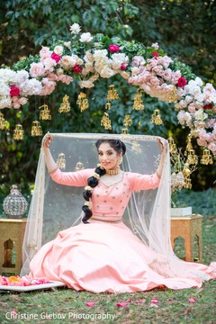 Maharani posing for pictures under the floral decor. Maharani posing for pictures under the floral decor.