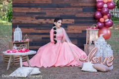 Indian bride posing with the decor items for the photoshoot. Indian bride posing with the decor items for the photoshoot.