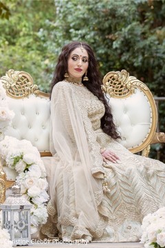 Indian bride wearing the ivory saree for pictures. Indian bride wearing the ivory saree for pictures.