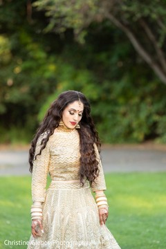 Indian bride wearing the bridal lengha outdoors. Indian bride wearing the bridal lengha outdoors.