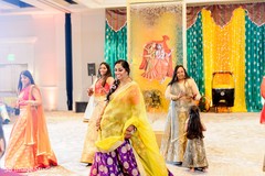 Indian bride with bridesmaids on their Sangeet lehengas. Indian bride with bridesmaids on their Sangeet lehengas.