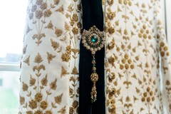 Indian groom's Dupatta with green jewelry. Indian groom's Dupatta with green jewelry.