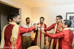 Indian groom with groomsmen having a toast with coffee. Indian groom with groomsmen having a toast with coffee.