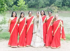 Indian bride posing with bridesmaids on their ceremony outfits. Indian bride posing with bridesmaids on their ceremony outfits.
