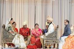 Indian couple seating on their wooden chairs at ceremony. Indian couple seating on their wooden chairs at ceremony.