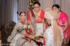 Indian bride with groom holding the leaf ritual. Indian bride with groom holding the leaf ritual.