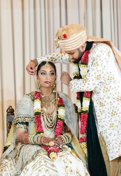 Indian groom puts the chain to bride ritual. Indian groom puts the chain to bride ritual.