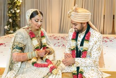Indian couple looking at their wedding rings. Indian couple looking at their wedding rings.