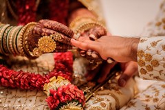 Maharani putting wedding ring to bride. Maharani putting wedding ring to bride.