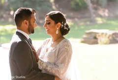 Indian couple wearing their reception outfits capture. Indian couple wearing their reception outfits capture.