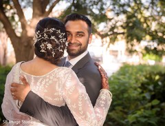 Indian groom hugging bride. Indian groom hugging bride.