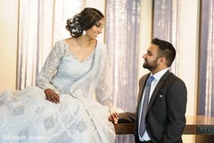 Romantic Indian bride and groom looking at each other. Romantic Indian bride and groom looking at each other.