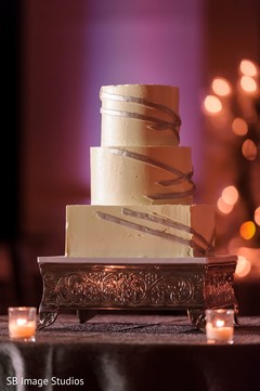 White and golden Indian wedding cake. White and golden Indian wedding cake.