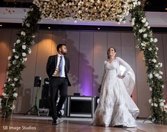 Indian bride and groom at reception dance. Indian bride and groom at reception dance.