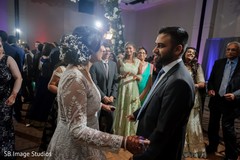 Indian couple dancing with wedding guests. Indian couple dancing with wedding guests.