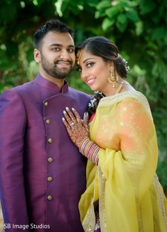 Indian groom and bride posing on their pre-wedding outfits. Indian groom and bride posing on their pre-wedding outfits.