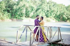 Indian couple posing on a bridge outdoors. Indian couple posing on a bridge outdoors.