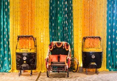 Yellow and green draping decoration and tuc tuc carriage decoration. Yellow and green draping decoration and tuc tuc carriage decoration.