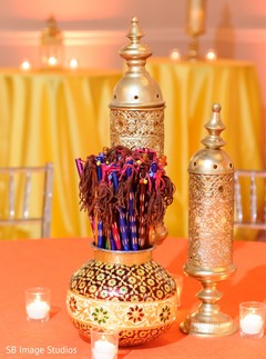Golden Sangeet table lanterns and pot decoration. Golden Sangeet table lanterns and pot decoration.