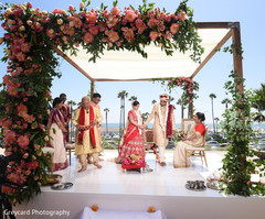 Indian couple walking on their wedding altar. Indian couple walking on their wedding altar.