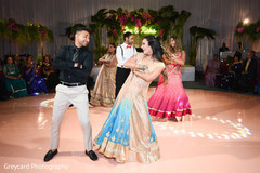 Indian couple dancing at the reception venue. Indian couple dancing at the reception venue.