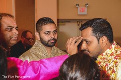 Raja receiving the bindi as guests observe. Raja receiving the bindi as guests observe.