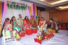 Indian groom and bride with family during the pre-wedding rituals. Indian groom and bride with family during the pre-wedding rituals.